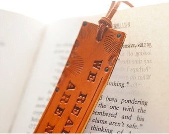 Leather bookmark - We Read to Know We Are Not Alone - C.S. Lewis quote - stamped, tooled and stained with turquoise embellishments
