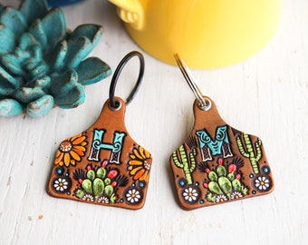 Cow Ear Tag shaped Custom initial leather key fob - Cacti, Saguaros, Sunflowers, Daisies keychain - hand painted Cactus Succulent tag