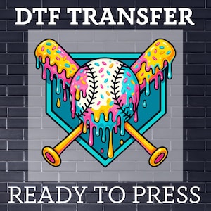 May include: A colorful baseball-themed iron-on transfer design featuring a baseball with sprinkles and two crossed bats with sprinkles, all dripping with colorful icing. The design is set against a blue baseball diamond. The text "DTF TRANSFER READY TO PRESS" is below the design.