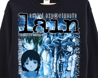May include: Black sweatshirt featuring the text "Serial Experiments Lain" in a stylized font, with a blue and white graphic of anime characters. The design includes Japanese text and the phrase "NO MATTER WHERE YOU GO, EVERYONE'S CONNECTED."