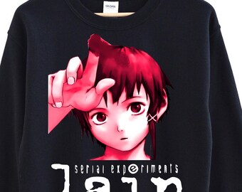 May include: Black sweatshirt featuring a graphic of an anime character with red hair and the text "serial experiments lain" in white. The character is pointing upwards with their index finger.