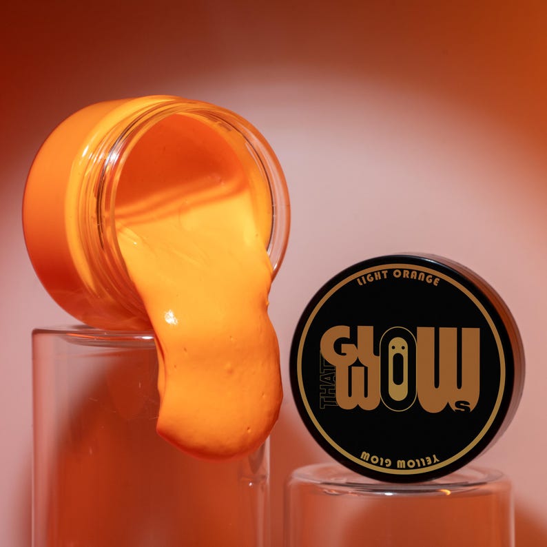 Bright orange acrylic paint in daylight, smooth texture ideal for crafting neon toys, handmade jewelry and keychain decorations