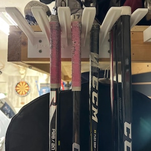 Hockey stick organizer.   Neatly store up to 10 sticks