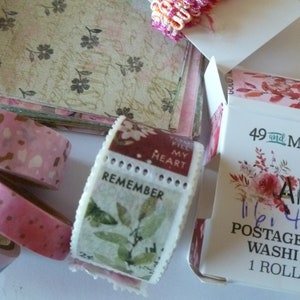 May include: A roll of floral patterned washi tape with the text "Art Options" and "11/16" 4 feet Postage Stamp Washi Tape 1 Roll 5M" on the packaging.
