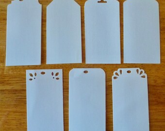 White 2 x 4” DIY Tags. Thick White Card Stock. Top Corners Punched in a variety of shapes. Order 12, 24 or 36. Organizing