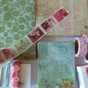 May include: A collection of decorative washi tapes with floral patterns and the words "You fill my heart", "Remembrance", "Forever", and "Always" printed on them. The tapes are arranged on a background of patterned paper.
