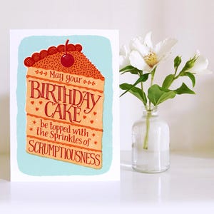 May include: A birthday card with a slice of cake illustration. The card reads "May your birthday cake be topped with the sprinkles of scrumptiousness."