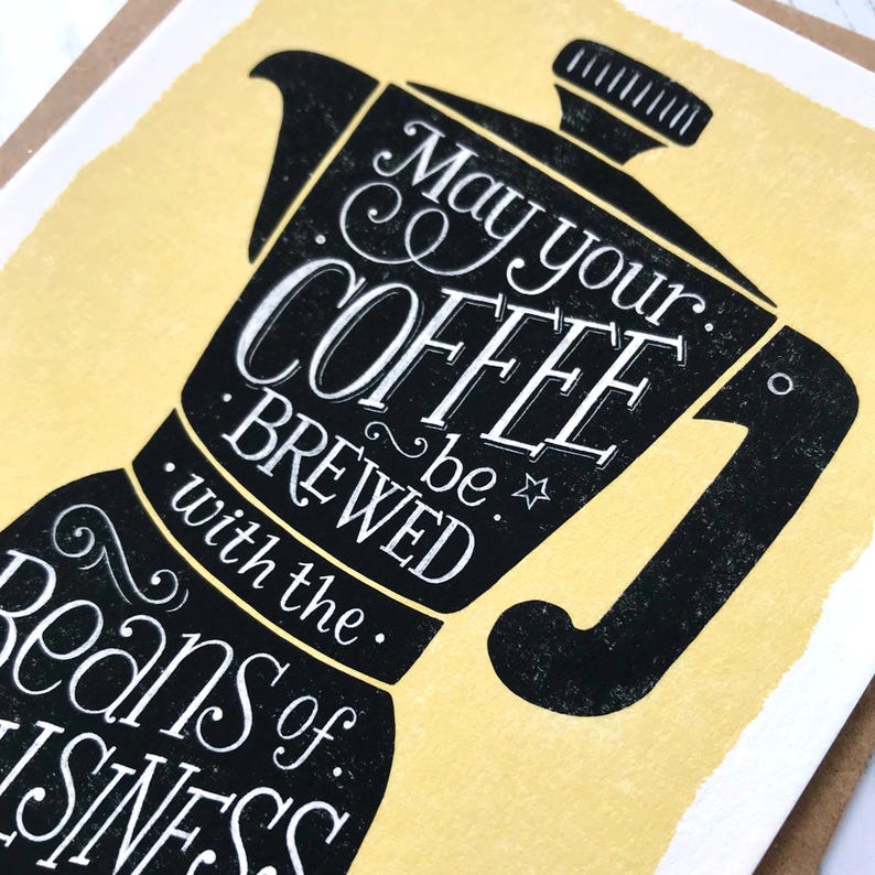 May include: A yellow card with a black illustration of a coffee pot. The text reads "May your coffee be brewed with the beans of business."