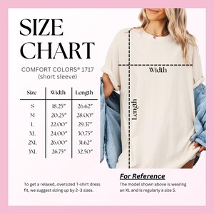 The image is a size chart for a T-shirt, showing the measurements for different sizes. The chart includes a model wearing the T-shirt and provides a reference for the model shown.