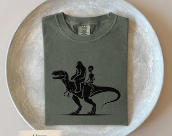 Bigfoot Alien Dinosaur Abduction T-Shirt, Comfort Colors® UFO Footprint Shirt, UFO Lover Gift, Tee for Sasquatch Lover Space Fan, Paranormal