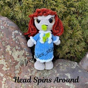 May include: A white ceramic mug with a black handle and the text "But First, Coffee" in a bold, black font. The mug is set against a neutral background, highlighting its simple design.