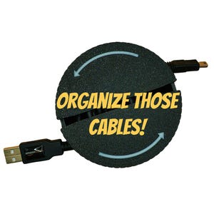 May include: A black cable organizer with the text "Organize Those Cables!" printed in yellow. The organizer is shaped like a circle and has two arrows pointing in opposite directions.