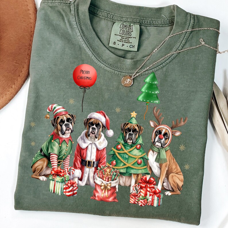 Festive Christmas design featuring four boxer dogs in holiday costumes. The boxer dogs are dressed as Santa Claus, a reindeer, a Christmas tree, and an elf, surrounded by Christmas gifts and decorations. High-quality digital PNG with transparent background, perfect for sublimation projects, holiday crafts, T-shirts, mugs, and unique Christmas gifts for boxer lovers and pet owners. Bright, detailed artwork that captures the joy of the holiday season.