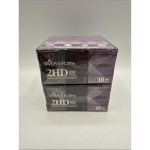 May include: Two stacked boxes of Imation 2HD diskettes. The boxes are mainly dark purple with white text and a textured design. Each box displays the number "10".