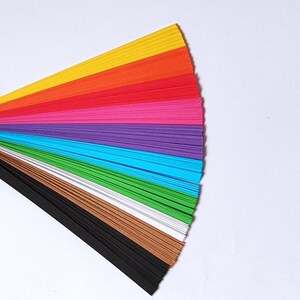10 Colors Quilling Paper Strips - High Quality 180 gsm Rainbow Palette Set DIY Kit, Typography & 3D Effect, Perfect Craft Supplies. Quilling paper strips in various widths, including 3mm, 5mm, 7mm, and 10mm. The paper is 180 GSM and comes in a pack of 100 strips. The text on the image reads '180 GSM 100 strips/pack 3 mm, 5 mm, 7mm, 10 mm Best for - On-edge quilling, Lettering, Outline quilling and Structured designs'.