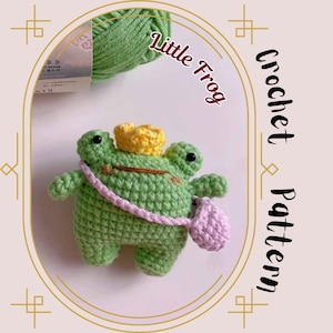 May include: A green crocheted frog wearing a yellow crown and a pink crocheted bag. The text "Little Frog" is written in red on a white background. The text "Crochet Pattern" is written vertically in black on a white background.