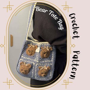 May include: A crocheted tote bag with a blue and white pattern and four brown bear faces. The bag has a long strap and the text "Bear Tote Bag" is written on the strap.