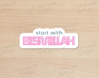 May include: A white sticker with pink text that says "start with BISMILLAH". The sticker is on a light brown wood background.
