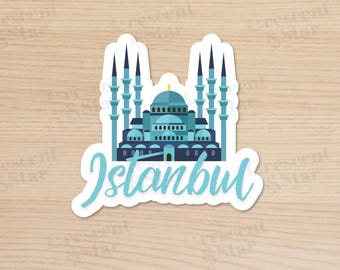 May include: A sticker featuring a teal illustration of a mosque with multiple minarets and a central dome. The word "Istanbul" is written in a cursive font below the mosque.