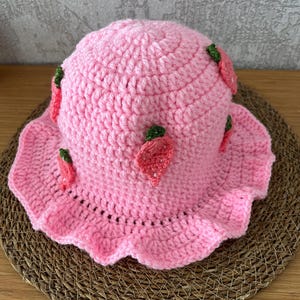 handmade crochet strawberry bucket hat – pastel pink, soft vibes