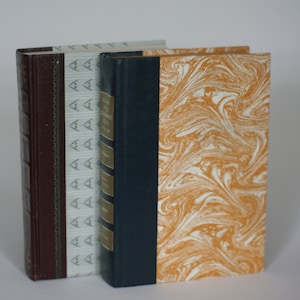 vintage readers digest books with graphic covers set of two