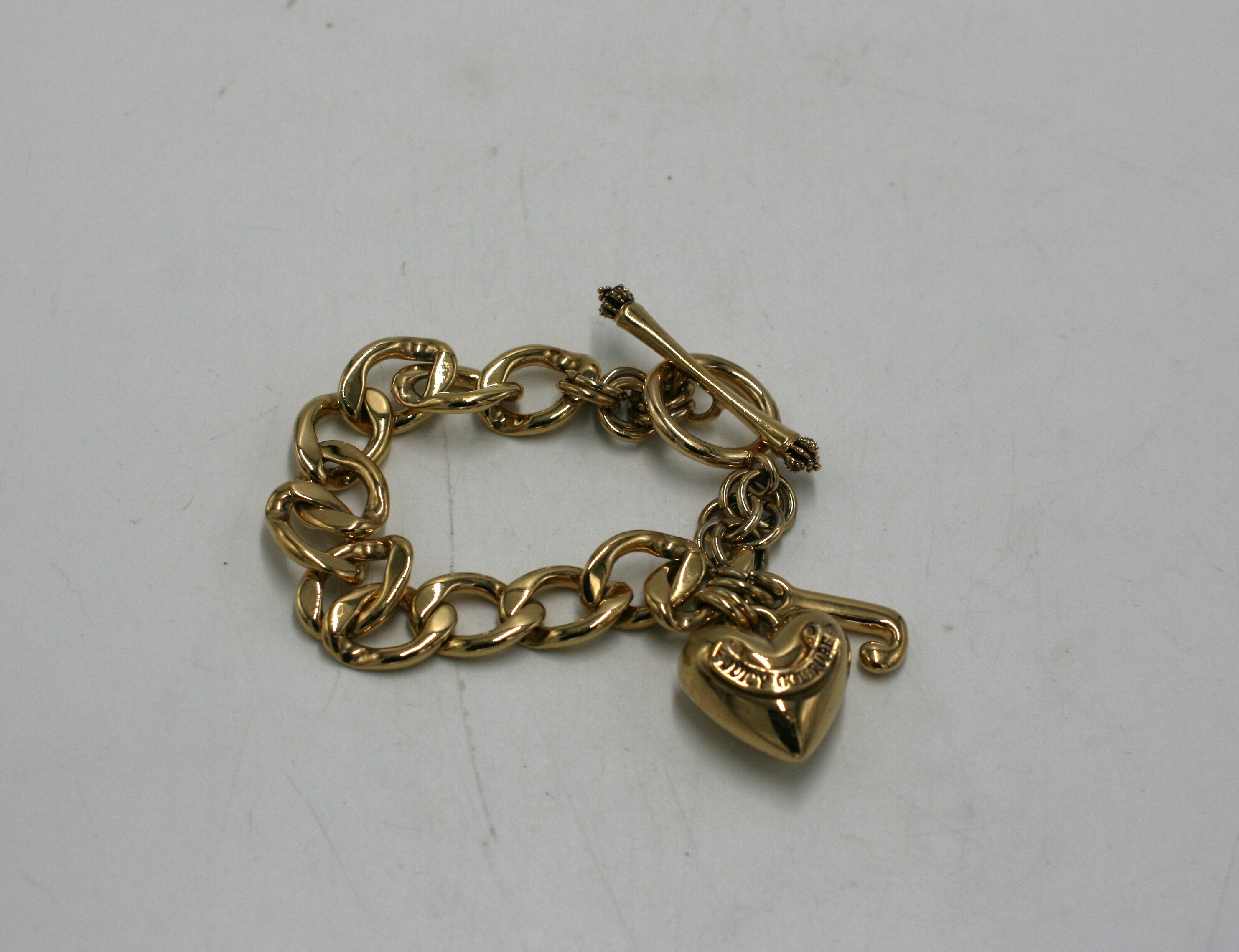 Juicy Couture gold puffed heart charm toggle bracelet - $44 - From Valerie