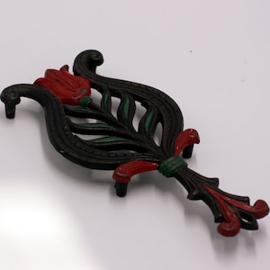 vintage Wilton cast iron trivet with red tulip