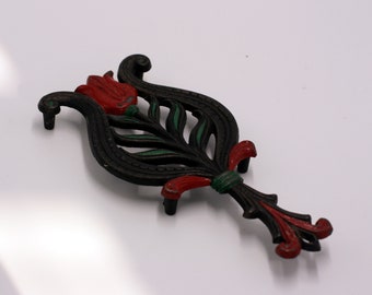 vintage Wilton cast iron trivet with red tulip