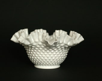 May include: A white milk glass bowl with a ruffled edge and a textured, dotted surface.