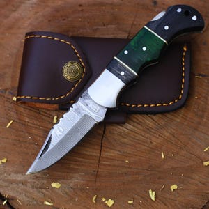 Handcrafted Damascus Steel Folding Knife: Wood Handle, Leather Sheath