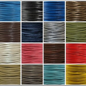 May include: A collection of 16 spools of leather cord in various colors, including blue, black, brown, gray, white, pink, red, green, beige, and yellow. The cords are all the same thickness and are wound tightly on the spools.