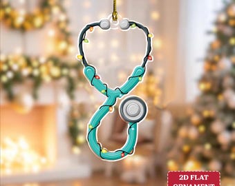 May include: A teal stethoscope Christmas ornament with a string of colorful lights. The ornament is hanging from a gold string. The text "2D FLAT ORNAMENT" is in a red rectangle in the bottom right corner.