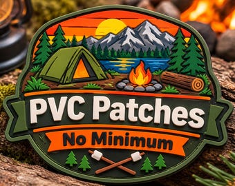 May include: A multi-colored PVC patch featuring a camping scene with a green tent, a campfire, a lake, and mountains under a yellow sun. The text reads PVC Patches and No Minimum, with two crossed marshmallow roasting sticks at the bottom.