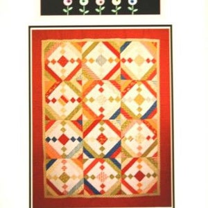 May include: A quilting pattern for a "Spinning Wishes" quilt, featuring a red, white, and yellow patchwork design. The pattern is from Fresh Cut Quilts Pattern Co.