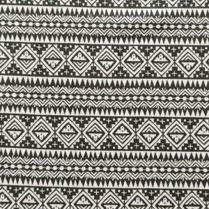 May include: Black and white patterned fabric with a repeating geometric design. The pattern includes diamonds, triangles, and cross shapes arranged in horizontal rows. The fabric has a tribal or ethnic aesthetic.
