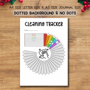 Op de afbeelding: Een witte schoonmaak tracker journal met de titel "Cleaning Tracker" in het zwart. Het journal heeft een cirkelvormig ontwerp met een handwas-afbeelding en een kleurgecodeerde sectie voor taken. De tekst "A4 SIZE LETTER SIZE & A5 SIZE JOURNAL SIZE" staat bovenaan.