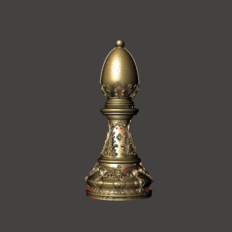 May include: A gold-colored chess bishop piece with intricate detailing. The piece has a rounded top and a detailed base with ornate carvings. Red accents are visible throughout the design, adding a touch of contrast to the metallic finish. The bishop is a classic chess piece.