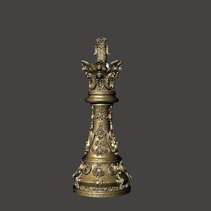 May include: A gold-colored chess king piece with ornate detailing. The piece has a tall, decorative crown and intricate carvings along its body. The chess piece is a classic design, suitable for a chess set.
