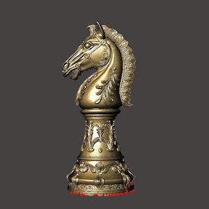 May include: A gold-colored chess knight piece. The knight is highly detailed with a horse head design, mane, and ornate base. The piece is a decorative item, likely for display or a chess set.