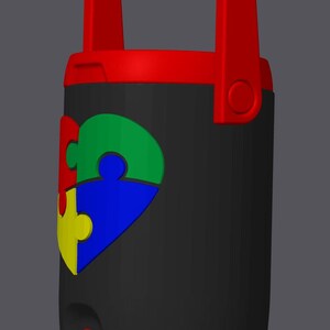 May include: A black water cooler with a red handle and accents. A colorful puzzle piece design in red, green, blue, and yellow is on the front. The cooler has a red spigot and a handle for easy carrying.