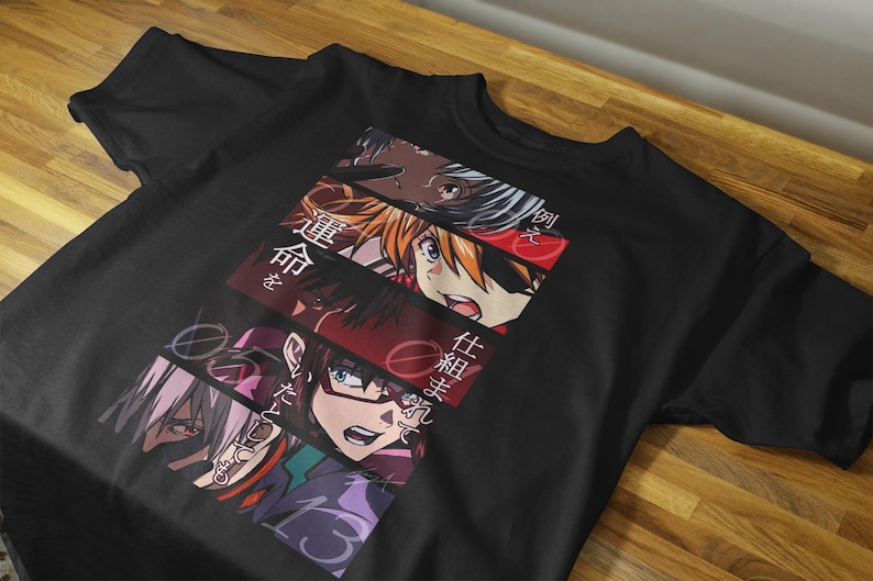 May include: Black t-shirt featuring a colorful anime-style graphic. The design includes multiple character portraits and Japanese text. The shirt is made of a soft material and is suitable for casual wear.
