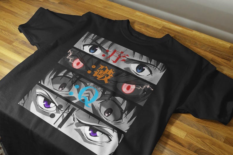 May include: Black t-shirt featuring a graphic design of anime eyes in various styles and colors. The design includes Japanese text in red and orange. The eyes have blue, red, and purple irises.