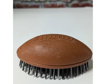 Cepillo quitapelusas Fuller Brush vintage con forma de balón de fútbol americano, años 70, fabricado en EE. UU., color marrón.