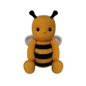 May include: A knitted bee plush toy in yellow and black stripes, with white wings and black antennae. The plush toy is sitting down and has a friendly expression. This handmade item is perfect for children.