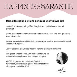 May include: A graphic with the text "HAPPINESSGARANTIE" in a decorative font. Below, text in German promises care in production, customer satisfaction, and environmental responsibility. A portrait of a woman and a signature are at the bottom.