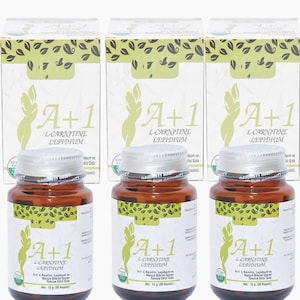 May include: Three brown supplement bottles with silver lids and white labels, each labeled "A+1 L-Carnitine Lepidium." The bottles are in front of three white boxes with green leaf designs and the same product name. Each bottle contains 15 grams of product.