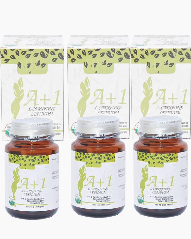 May include: Three brown supplement bottles with silver lids and white labels, each labeled "A+1 L-Carnitine Lepidium." The bottles are in front of three white boxes with green leaf designs and the same product name. Each bottle contains 15 grams of product.