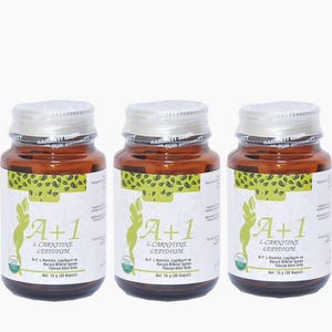 May include: Three brown glass bottles with silver lids and white labels. The labels feature the text "A+1 L-CARNITINE LEPIDIUM" and a green graphic. Each bottle is sealed with a silver band that reads "GARANTI BAN".