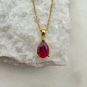 May include: A set of three ceramic mugs with a speckled, matte finish. The mugs are in shades of cream, light gray, and dark gray. Each mug has a simple, minimalist design, perfect for coffee or tea.