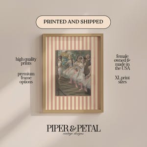 May include: Framed print featuring a ballet scene, with a pink and cream striped border. The print is in a wooden frame and includes the text "PRINTED AND SHIPPED" and "PIPER & PETAL vintage designs". Additional text includes "high quality prints" and "premium frame options".